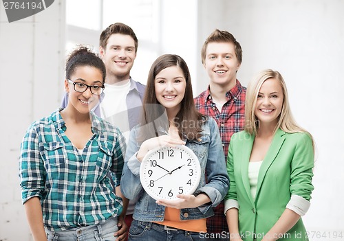 Image of group of students at school with clock