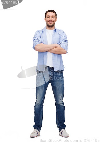 Image of smiling man with crossed arms