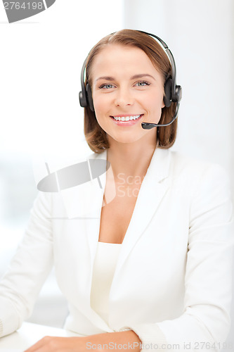 Image of smiling female helpline operator with headphones