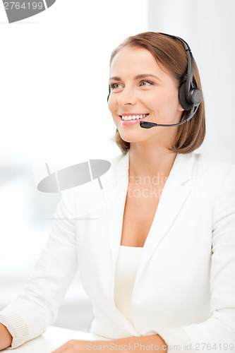 Image of smiling female helpline operator with headphones