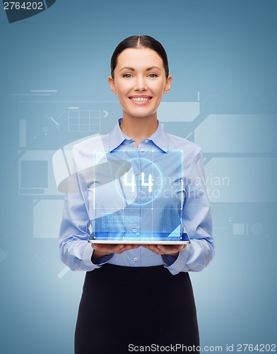 Image of smiling businesswoman with tablet pc