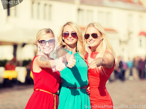 Image of three beautiful women in the city