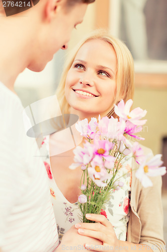 Image of couple with flowers in the city