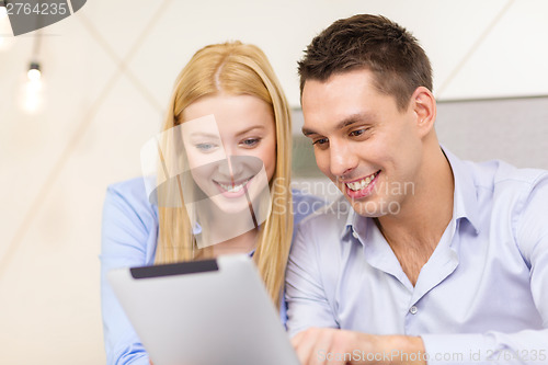 Image of couple with tablet pc computer in hotel room