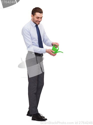 Image of handsome buisnessman with green watering can