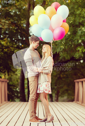 Image of couple with colorful balloons