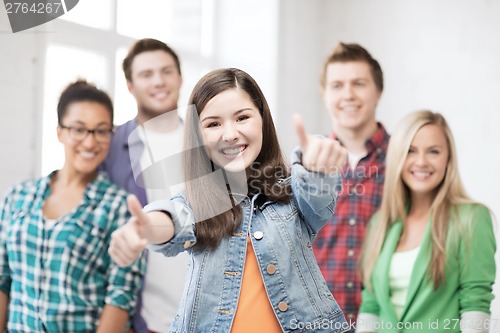Image of students showing thumbs up at school