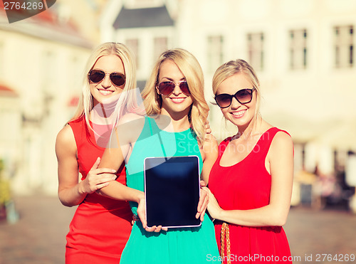 Image of tourist girls with tablet pc