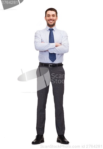 Image of handsome buisnessman with crossed arm
