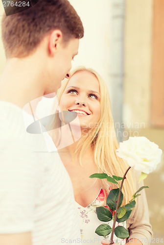 Image of couple with flowers in the city