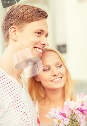 Image of couple with flowers in the city