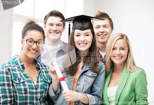 Image of student girl in graduation cap with diploma