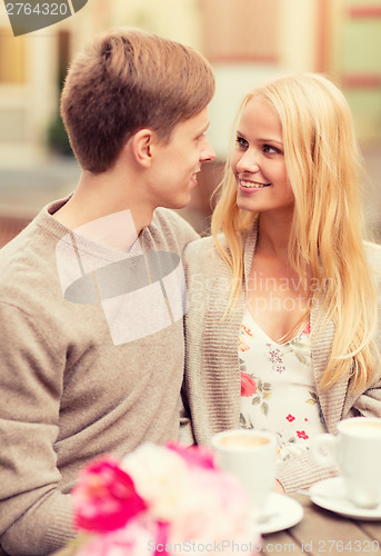 Image of romantic happy couple in the cafe
