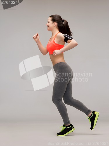 Image of sporty woman running or jumping