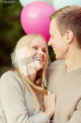 Image of couple with colorful balloons