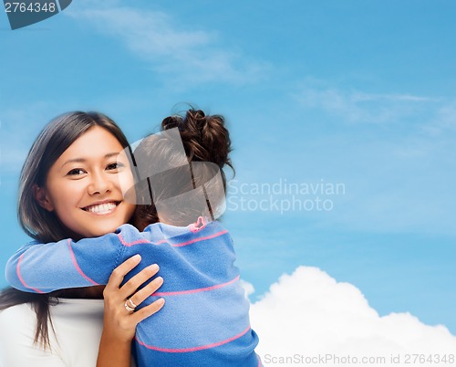 Image of hugging mother and daughter