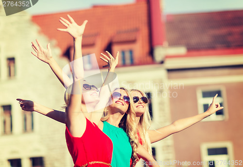 Image of three beautiful women in the city