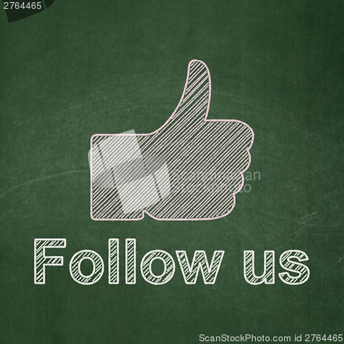 Image of Social network concept: Thumb Up and Follow us on chalkboard background
