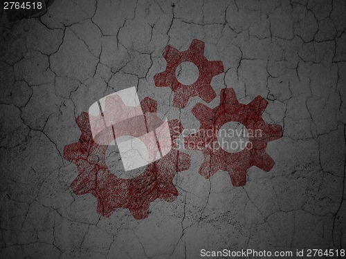 Image of Advertising concept: Gears on grunge wall background