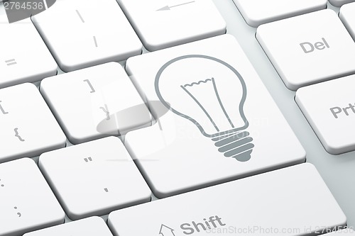 Image of Finance concept: Light Bulb on computer keyboard background