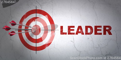 Image of Business concept: target and Leader on wall background