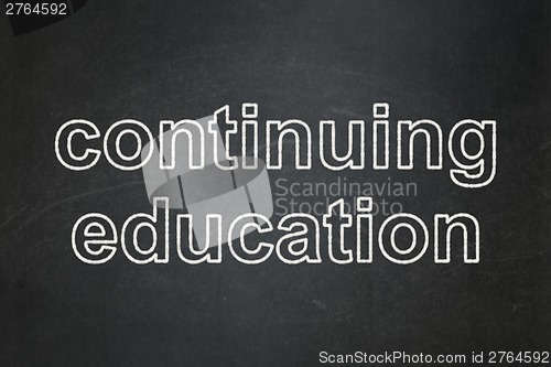 Image of Education concept: Continuing Education on chalkboard background