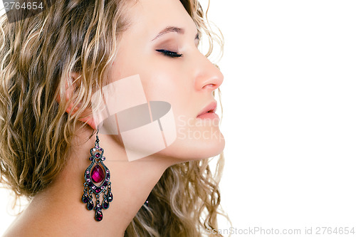 Image of portrait of a beautiful young girl with long blond wavy hair