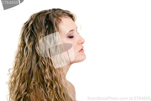 Image of portrait of a beautiful young girl with long blond wavy hair