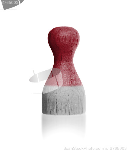 Image of Wooden pawn with a flag painting