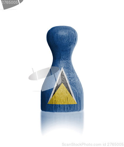 Image of Wooden pawn with a flag painting