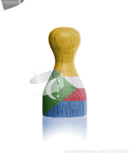 Image of Wooden pawn with a flag painting