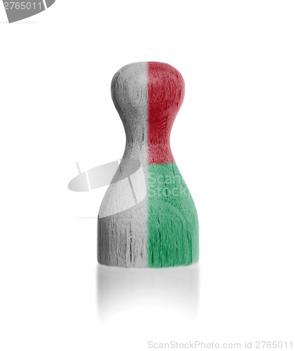 Image of Wooden pawn with a flag painting