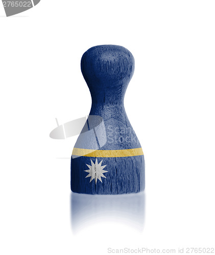 Image of Wooden pawn with a flag painting