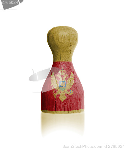 Image of Wooden pawn with a flag painting