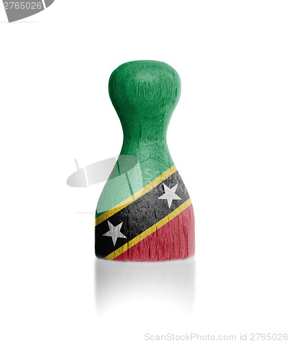 Image of Wooden pawn with a flag painting