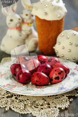 Image of Easter cake, eggs and rabbits.