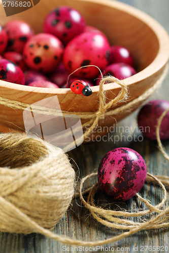 Image of Wooden bowl with Easter eggs.