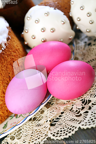 Image of Easter eggs and cakes on a napkin.