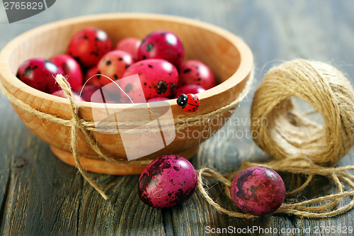 Image of Easter eggs in wooden bowl.