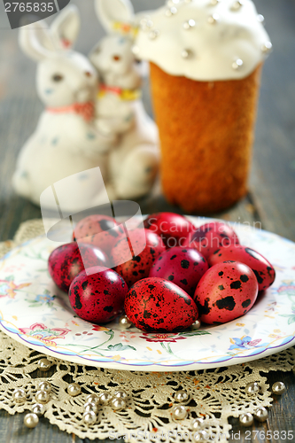 Image of Easter eggs, cake and funny bunnies.