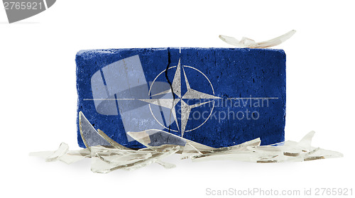 Image of Brick with broken glass, violence concept