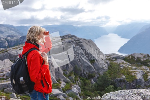 Image of Woman hiker on Pulpit Rock / Preikestolen, Norway