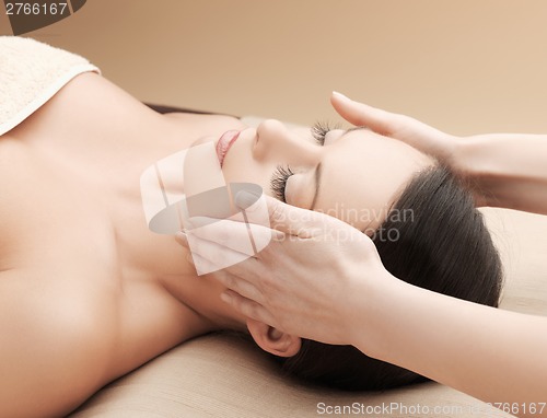 Image of beautiful woman in massage salon