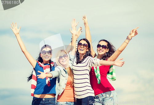 Image of beautiful teenage girls or young women having fun