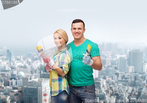 Image of smiling couple with paintbrush