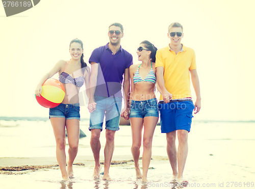 Image of group of friends having fun on the beach
