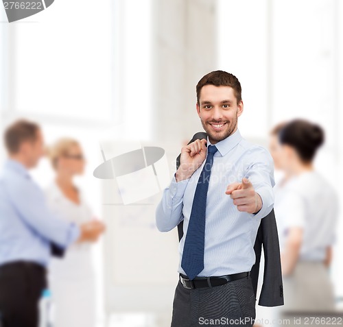 Image of handsome buisnessman with jacket over shoulder