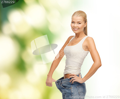 Image of sporty woman showing big pants