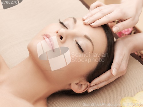 Image of beautiful woman in massage salon