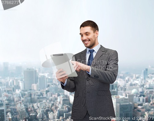 Image of smiling buisnessman with tablet pc computer